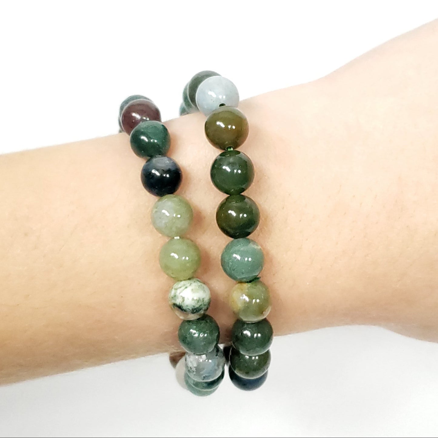 Beaded bracelet on a wrist against a white background