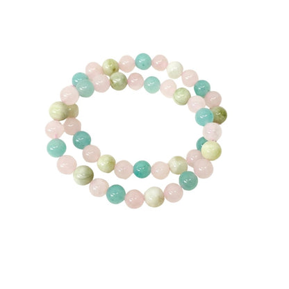 Two Amazonite, Jade and Rose Quartz crystal beaded stretch bracelet made of polished round gemstone beads in pastel pink, mint green, and pale yellow-green, arranged in a circle on a plain white background.