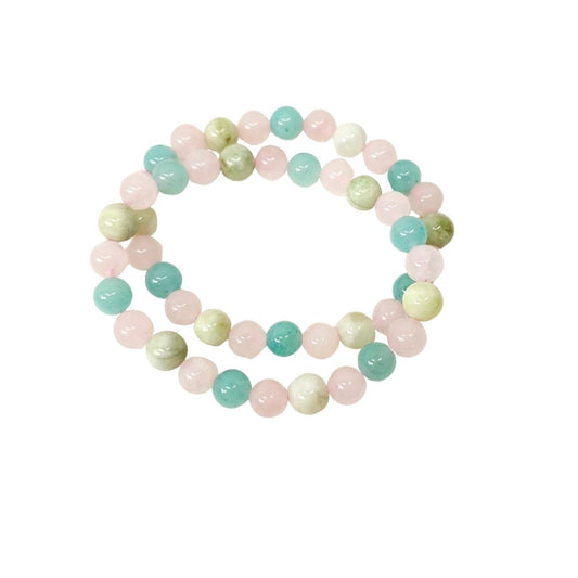 Two Amazonite, Jade and Rose Quartz crystal beaded stretch bracelet made of polished round gemstone beads in pastel pink, mint green, and pale yellow-green, arranged in a circle on a plain white background.