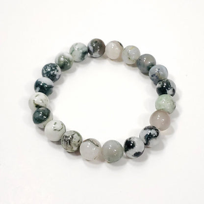 Green Moss Agtate Crystsal  Round beaded bracelet with gray and white stones on a white background