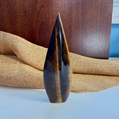 Golden Tiger Eye Flame crystal side angle showing flame shape and natural tiger eye banding patterns