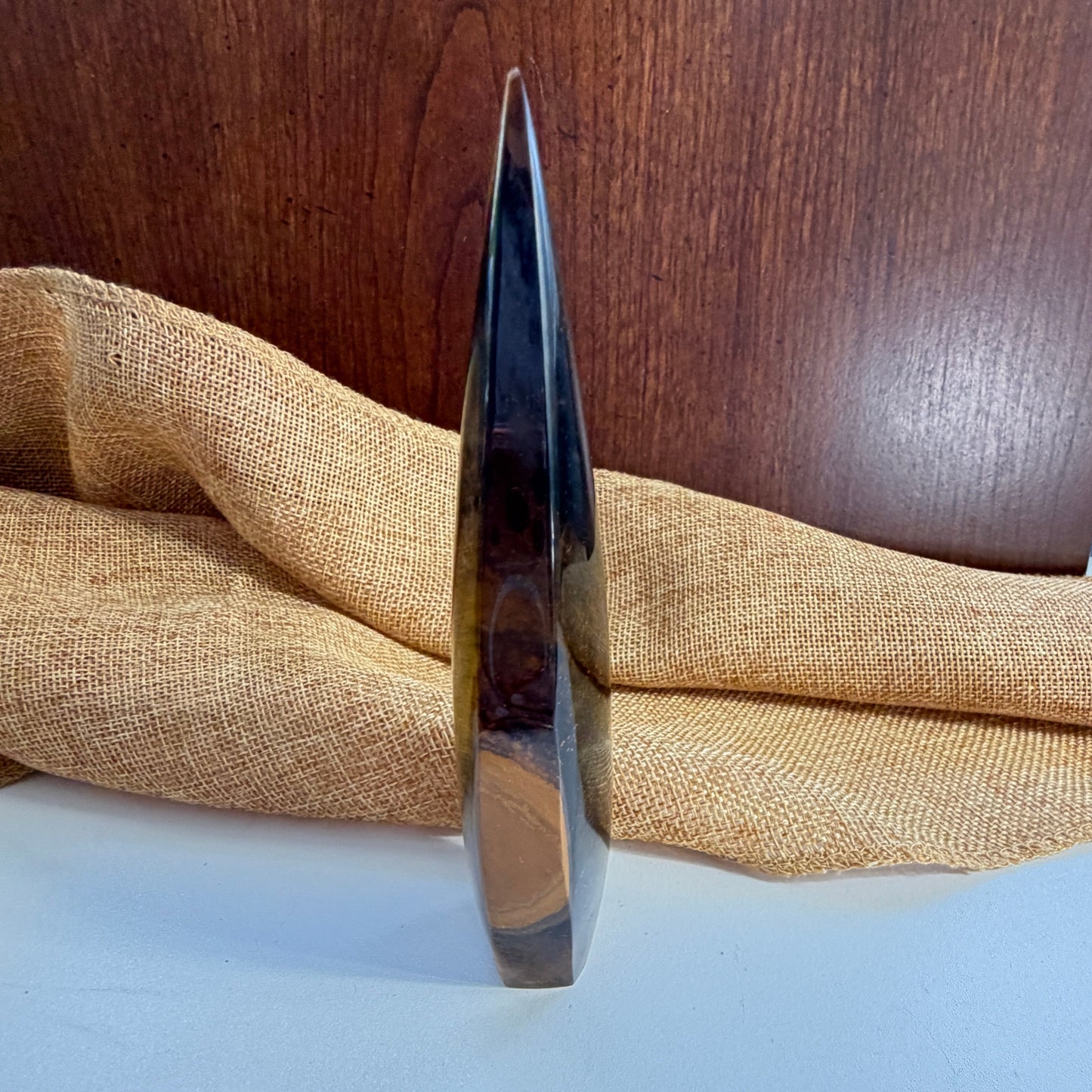Golden Tiger Eye Crystal Flame detail view highlighting the stone's protective and motivational energy properties