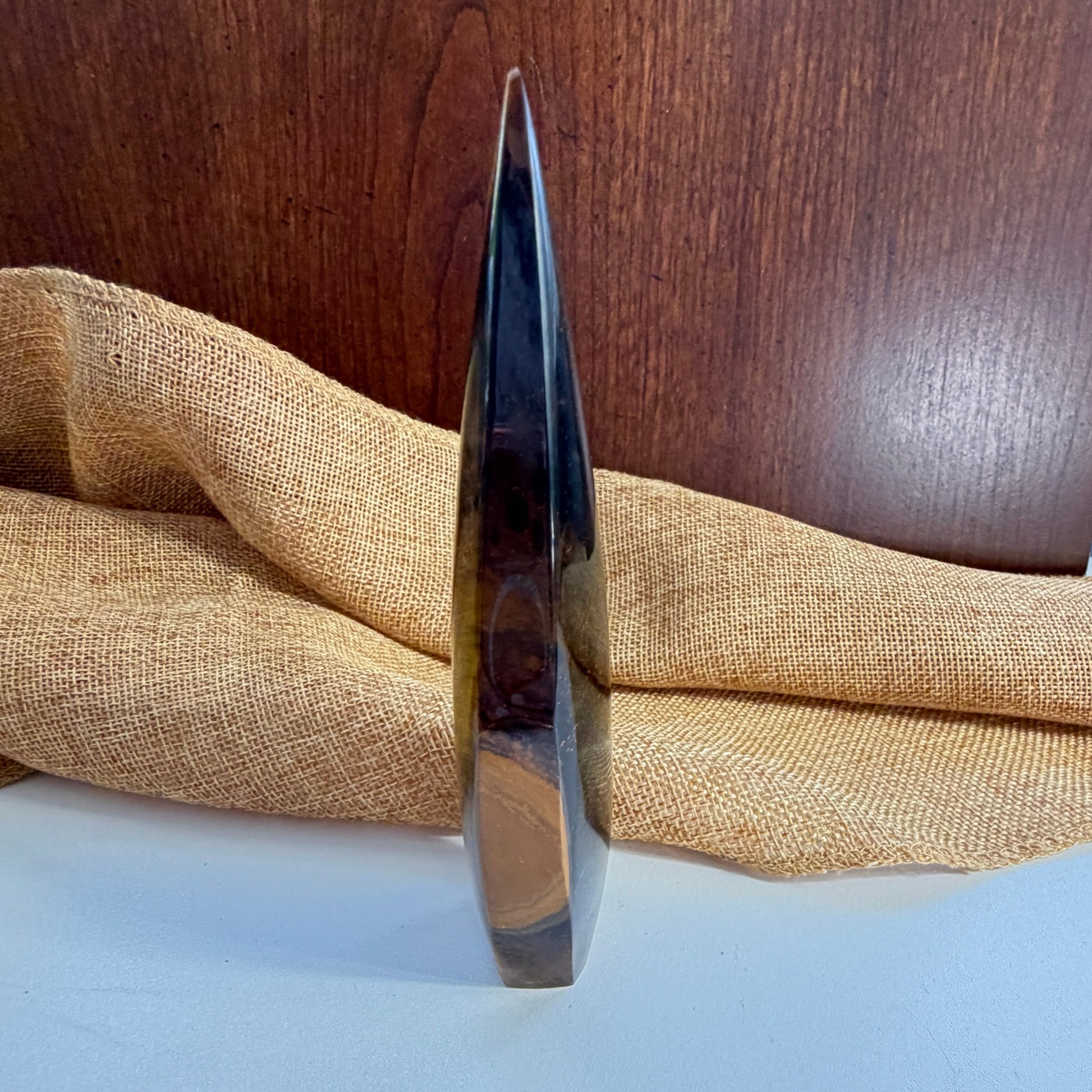 Golden Tiger Eye Crystal Flame detail view highlighting the stone's protective and motivational energy properties