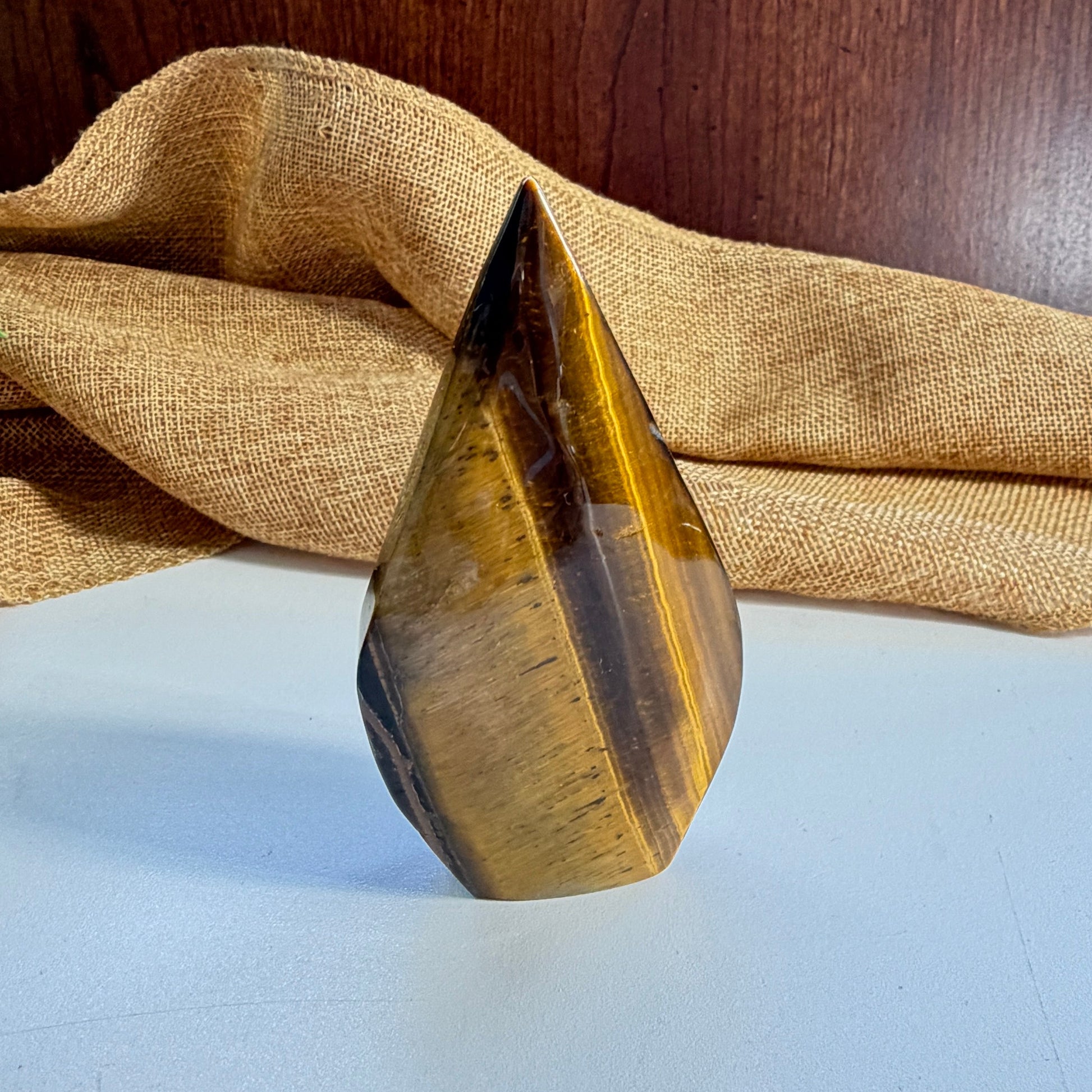 Small Golden Tiger Eye Flame crystal complete view - bold carving for clarity, forward momentum and personal streng