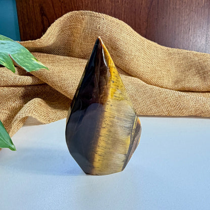 Golden Tiger Eye Flame crystal 95mm tall with warm golden-brown chatoyant bands for personal power and focused determination
