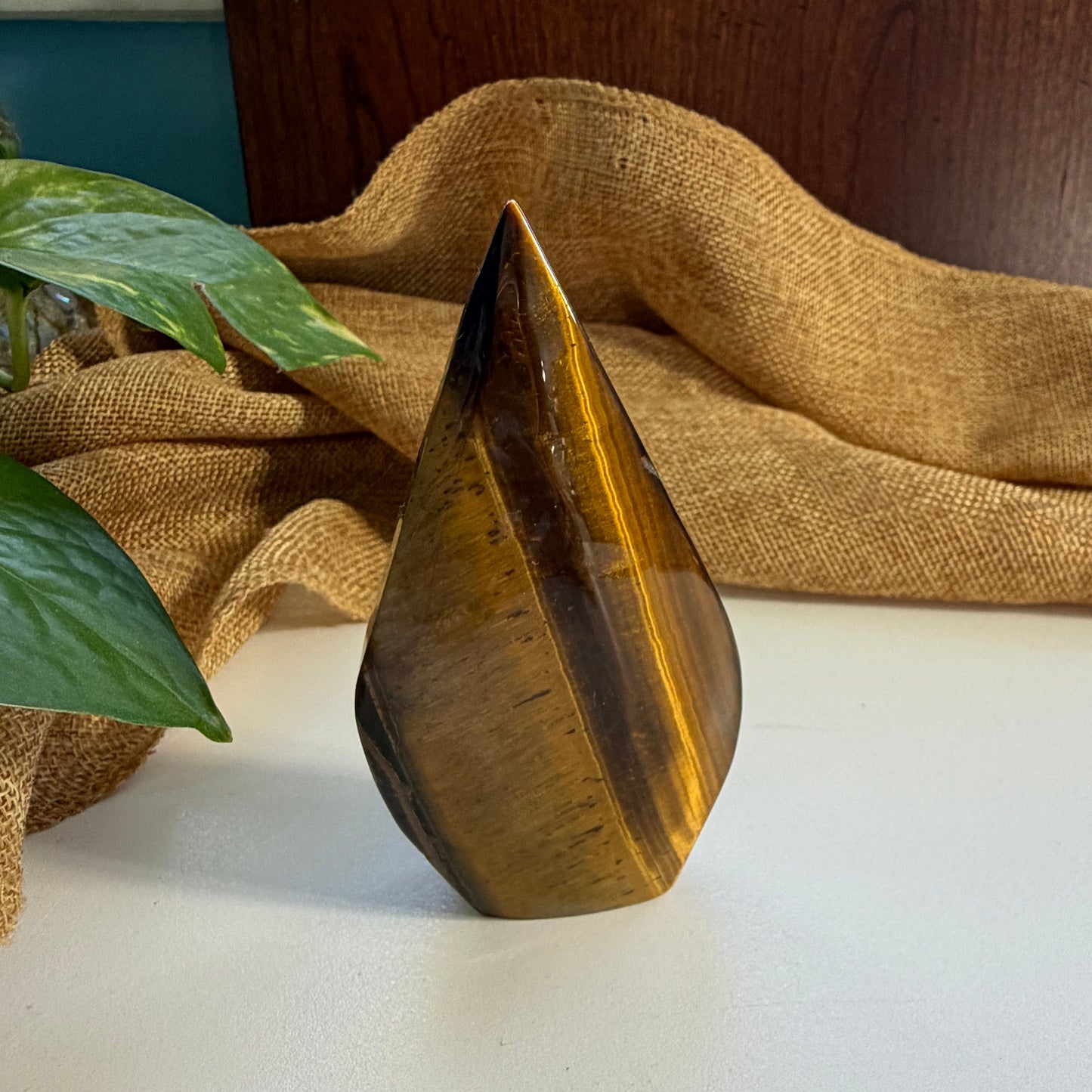olden Tiger Eye Flame carving side profile displaying dynamic flame shape and earthy golden striations for courage

