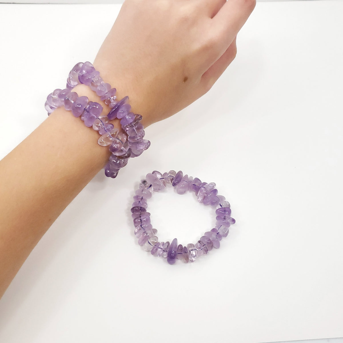 Purple amethyst nugget beaded bracelets, shown worn on a wrist and displayed flat on a white surface.